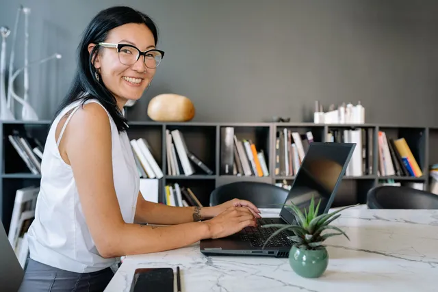 A dental practice administrator working at her desk