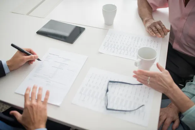Reviewing an insurance benefits breakdown on screen