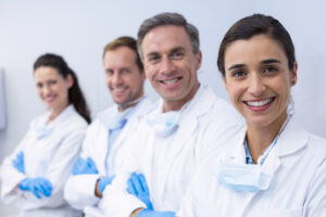 happy dentists with arms crossed